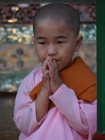 young child nun praying