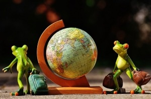 Globe and 2 frogs with suitcases, Around the world