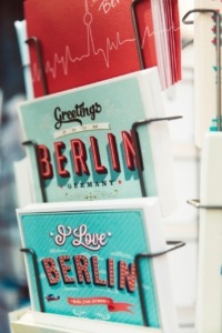 Postcards from Berlin in a stand